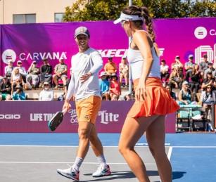 Pickleball players socializing after play at a resort
